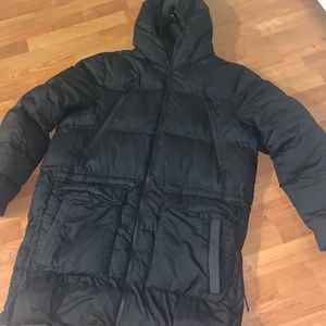 Championships coat size Large. This is a tall coat that stops at the knee.